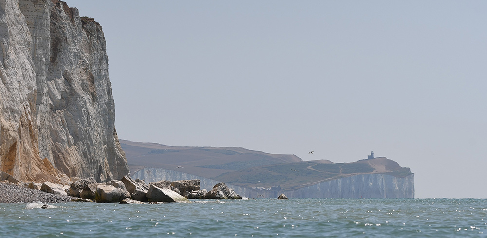 View of Belle Tout from on the sea at Seaford Head